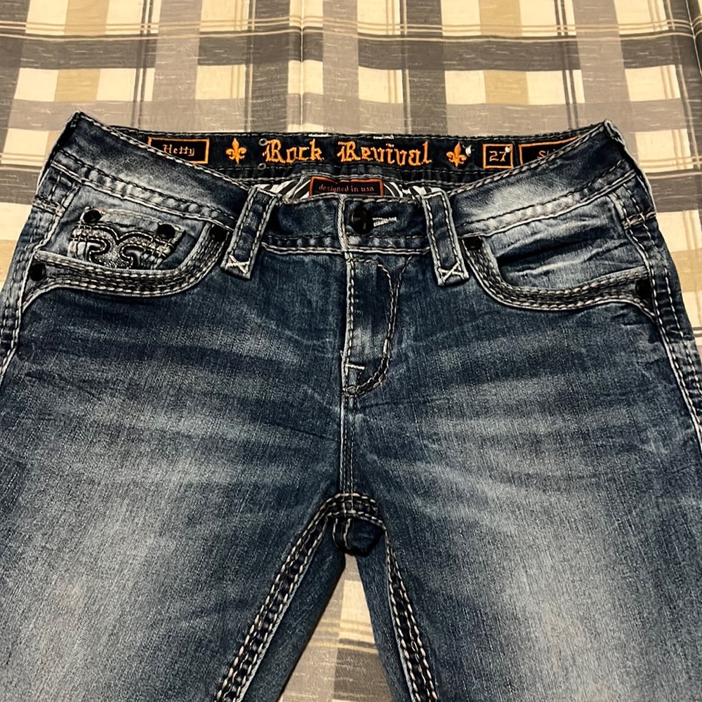 Really cute jeans with shinny black rhinestones on pockets and front button.